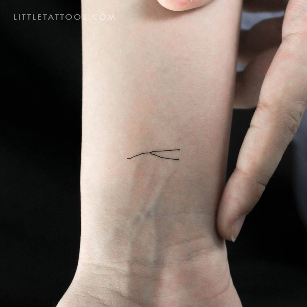 Tiny minimalistic Taurus constellation temporary tattoo.