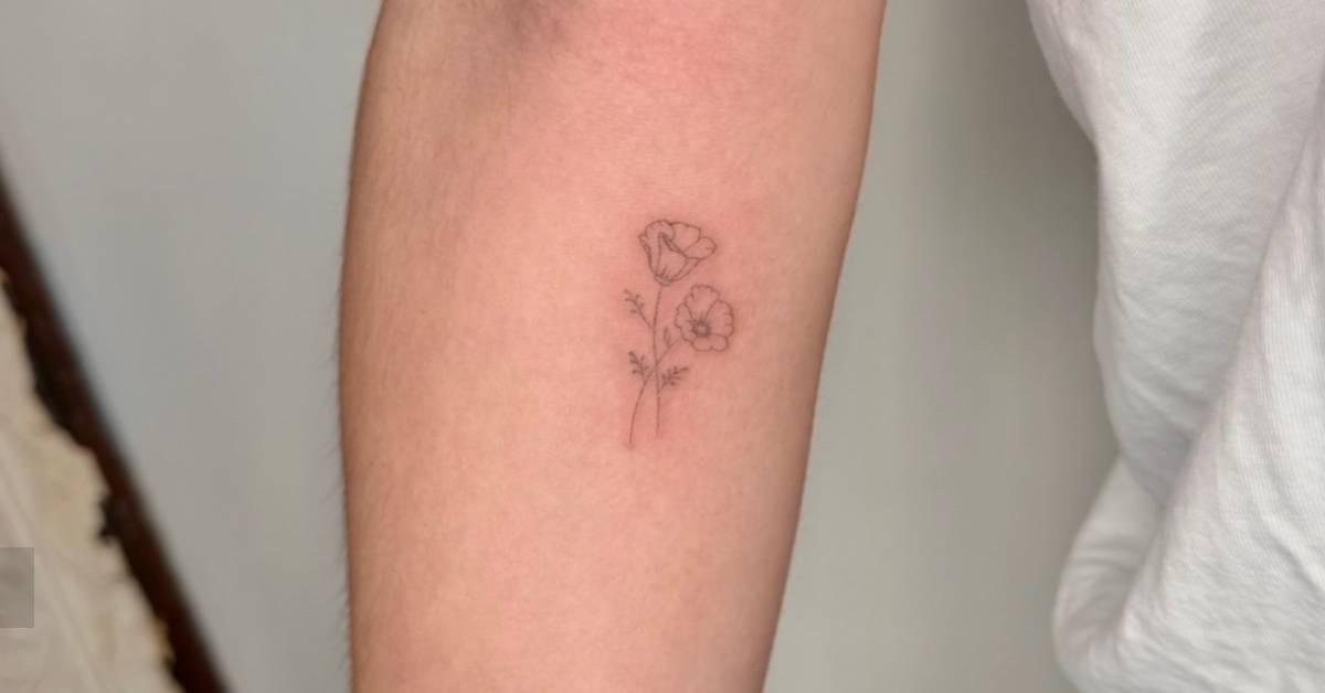 Poppy flowers tattoo placed on the inner forearm, fine