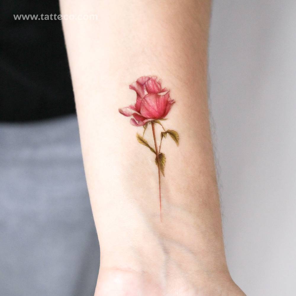 Fuchsia rose temporary tattoo located on the wrist.