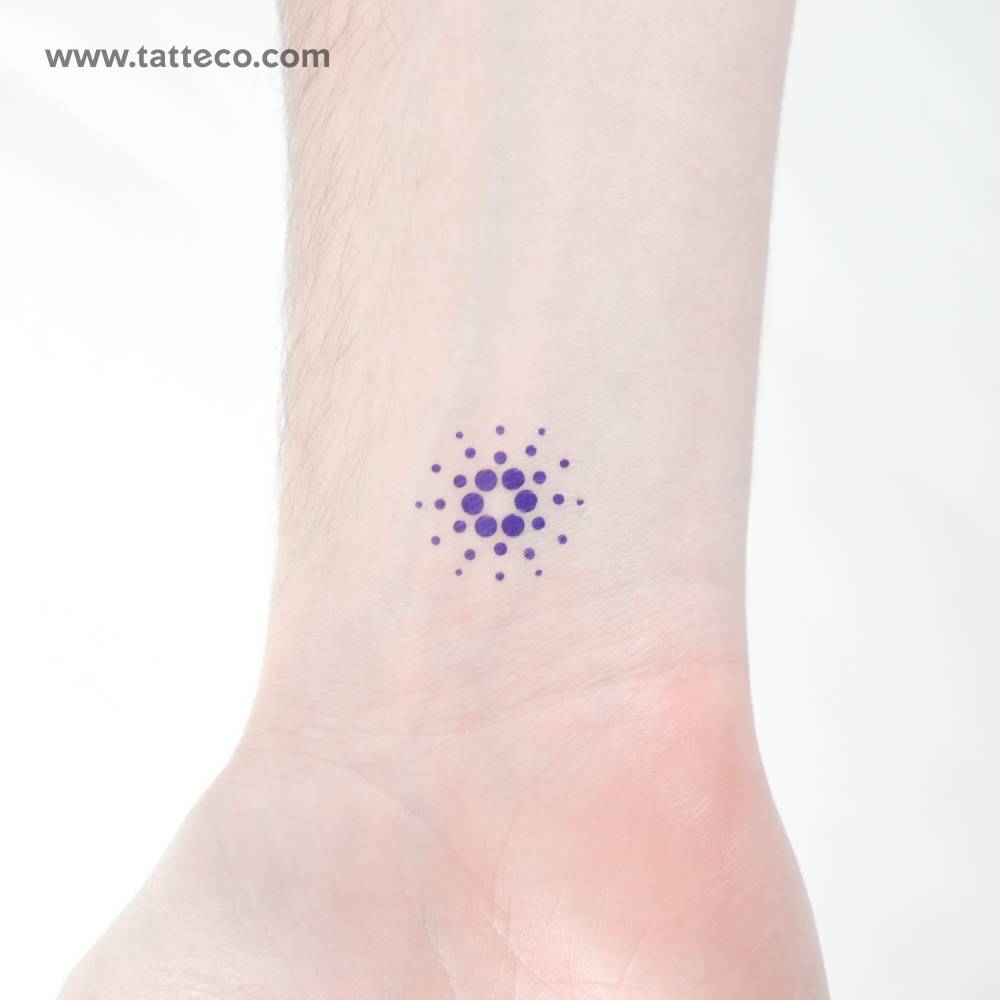 Cardano logo temporary tattoo located on the wrist.