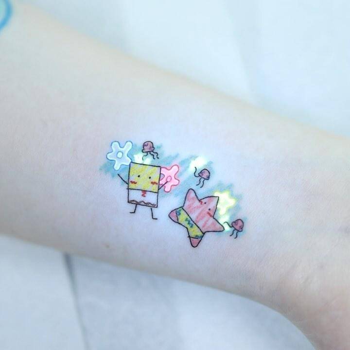 UV ink Spongebob and Patrick Star tattoo located on the wrist.