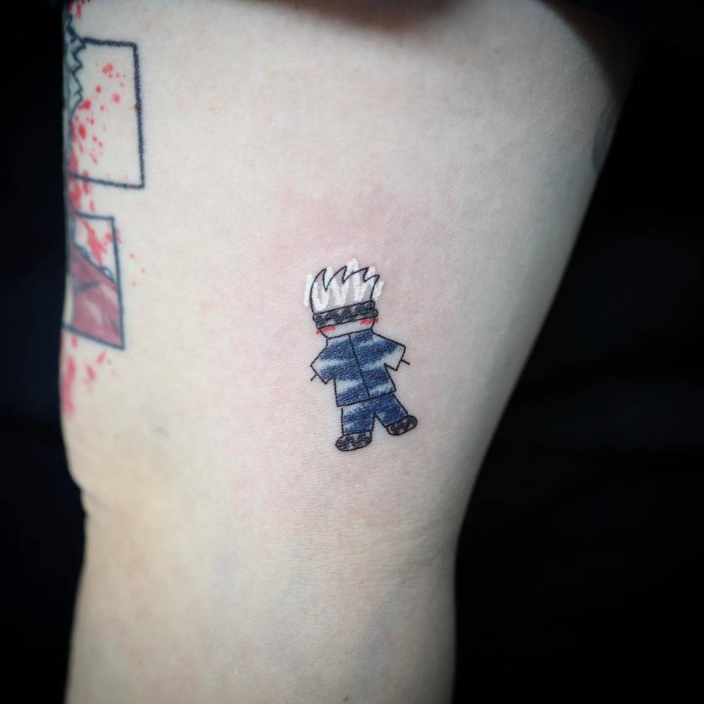 Jujutsu Kaisen tattoo located on the thigh, cartoon style.