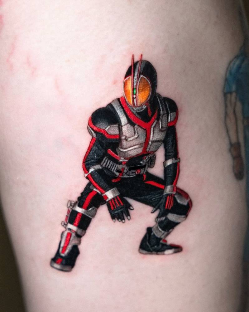 Kamen Rider tattoo in cartoon style located on the tricep.