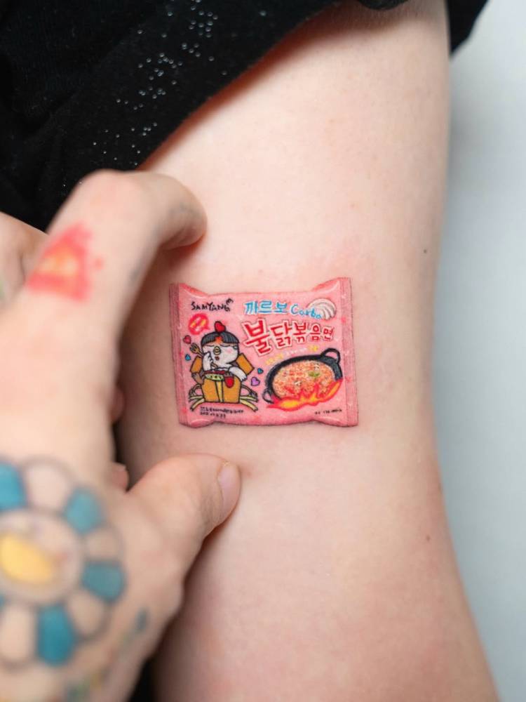 Micro-realistic style ramen tattoo located on the bicep.