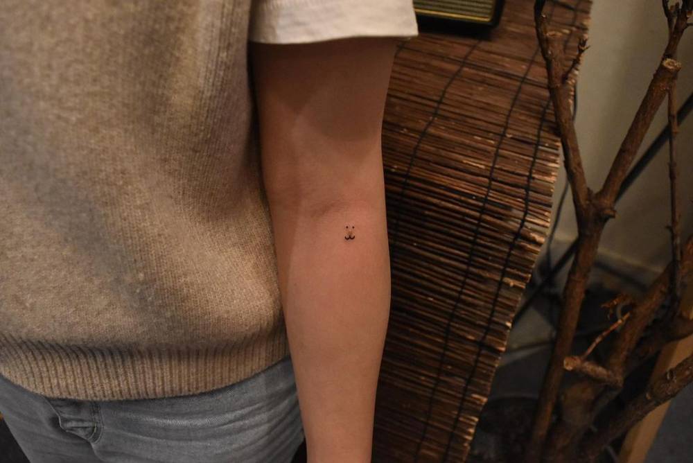 Birthmark cover up bear tattoo on the inner forearm.