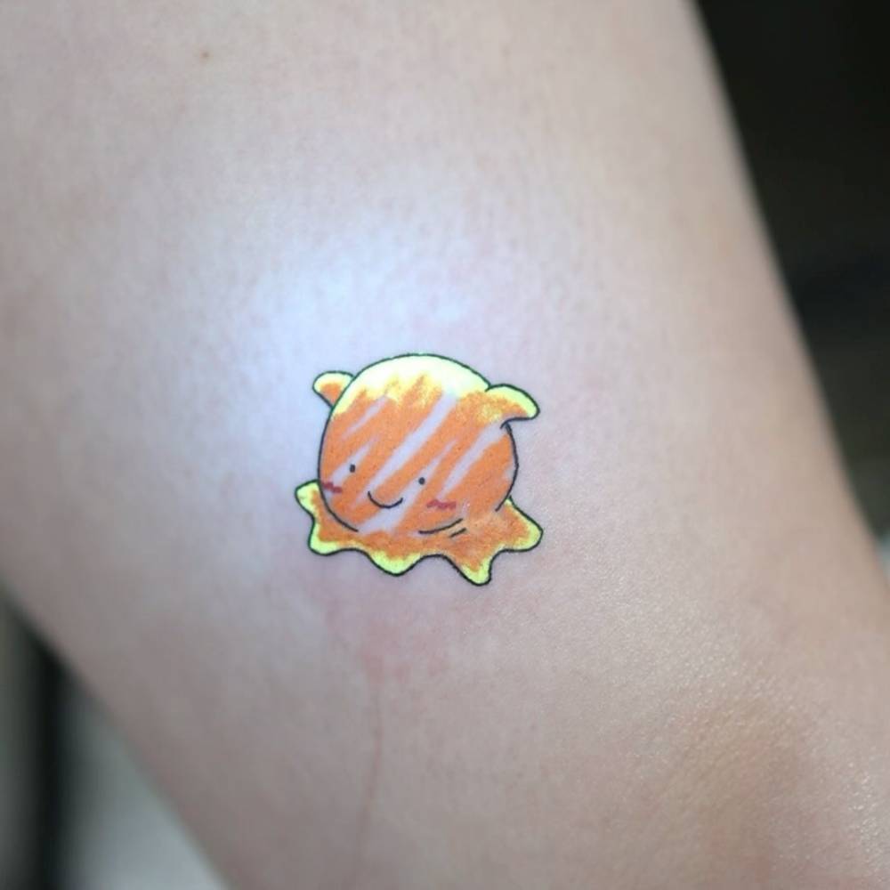 UV ink umbrella octopus tattoo in cartoon style located on the thigh.