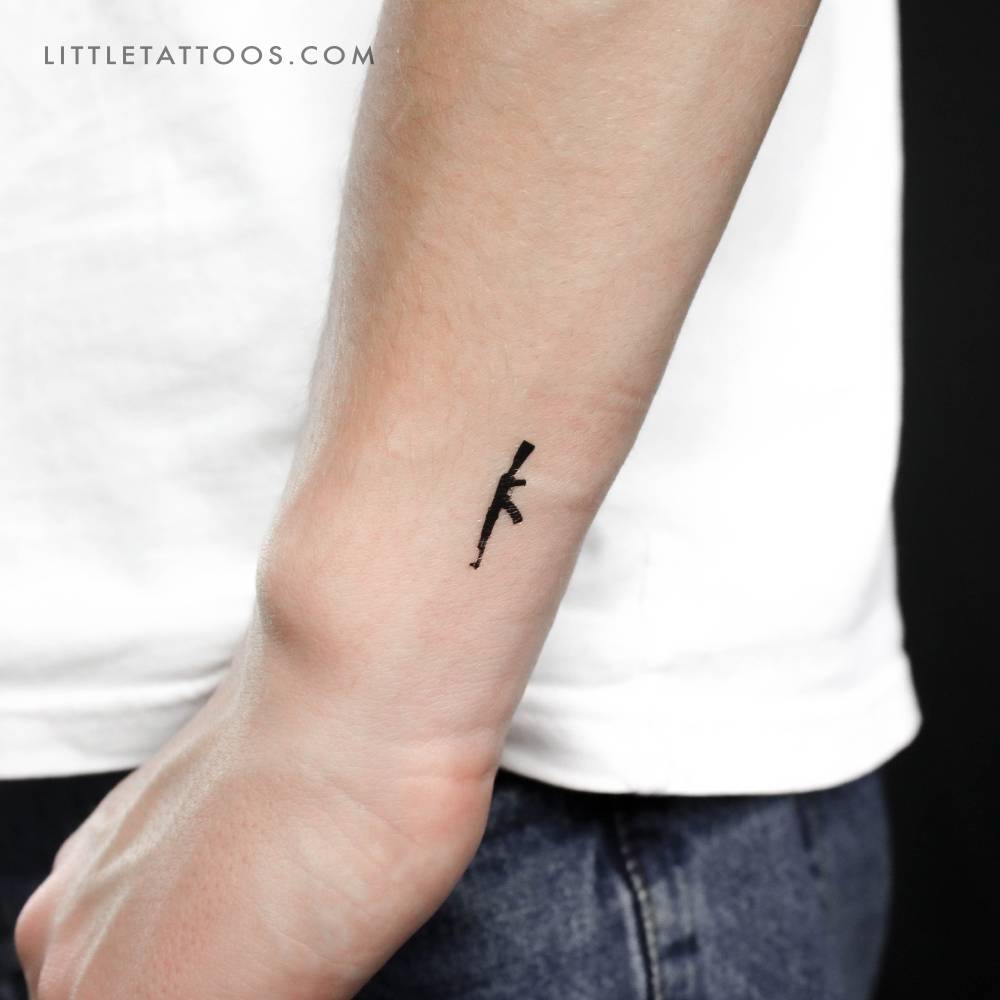 Kalashnikov assault rifle temporary tattoo located on the wrist.
