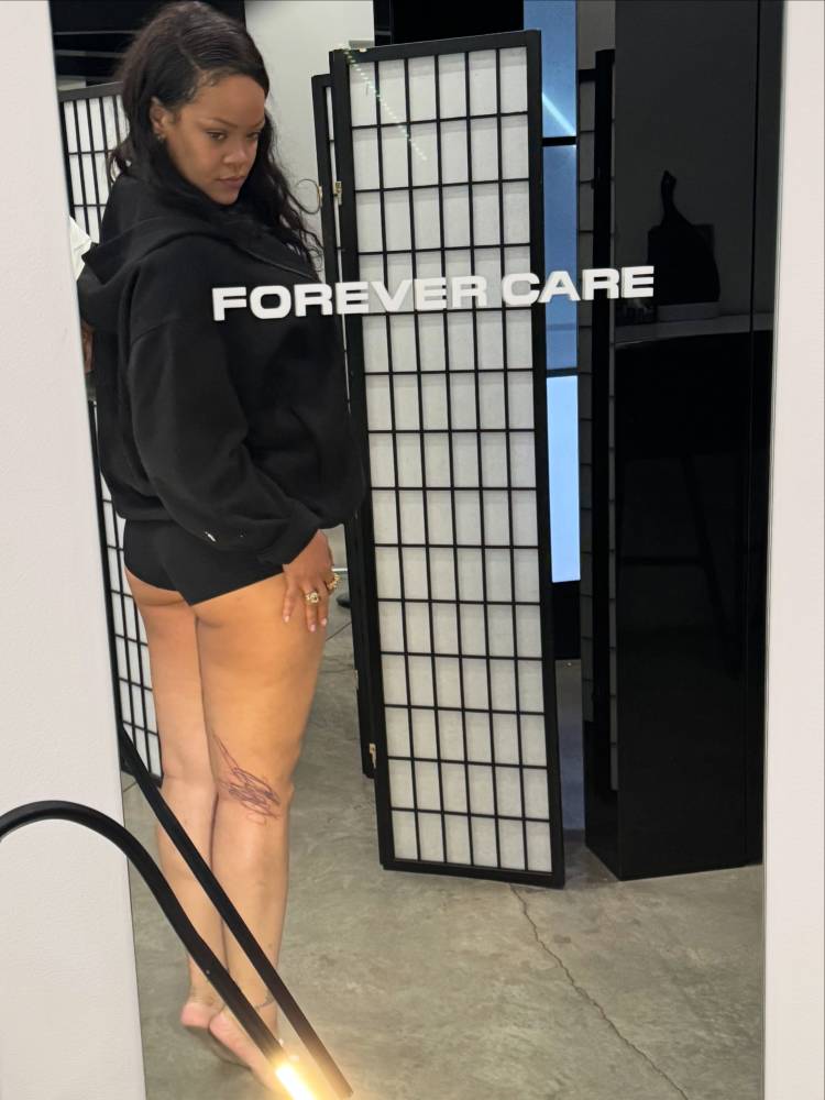 Scribble designed by her children tattooed on Rihanna's leg.