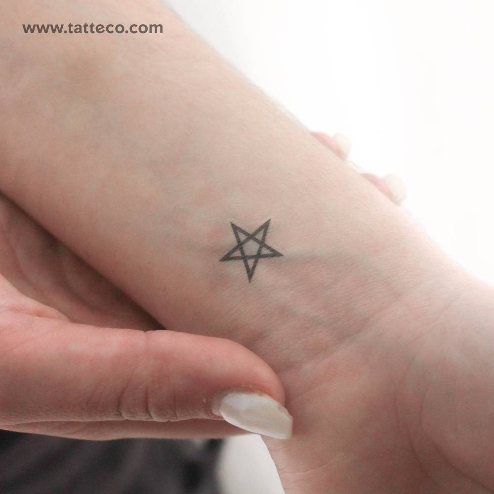 Pentagram temporary tattoo located on the wrist.