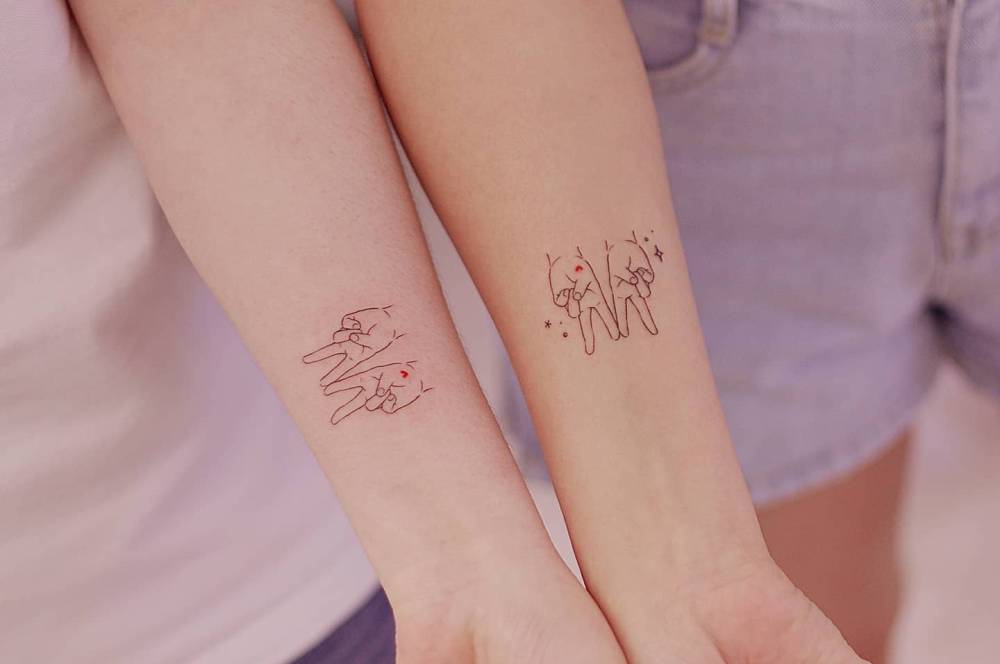 Matching V sign tattoo for best friends.