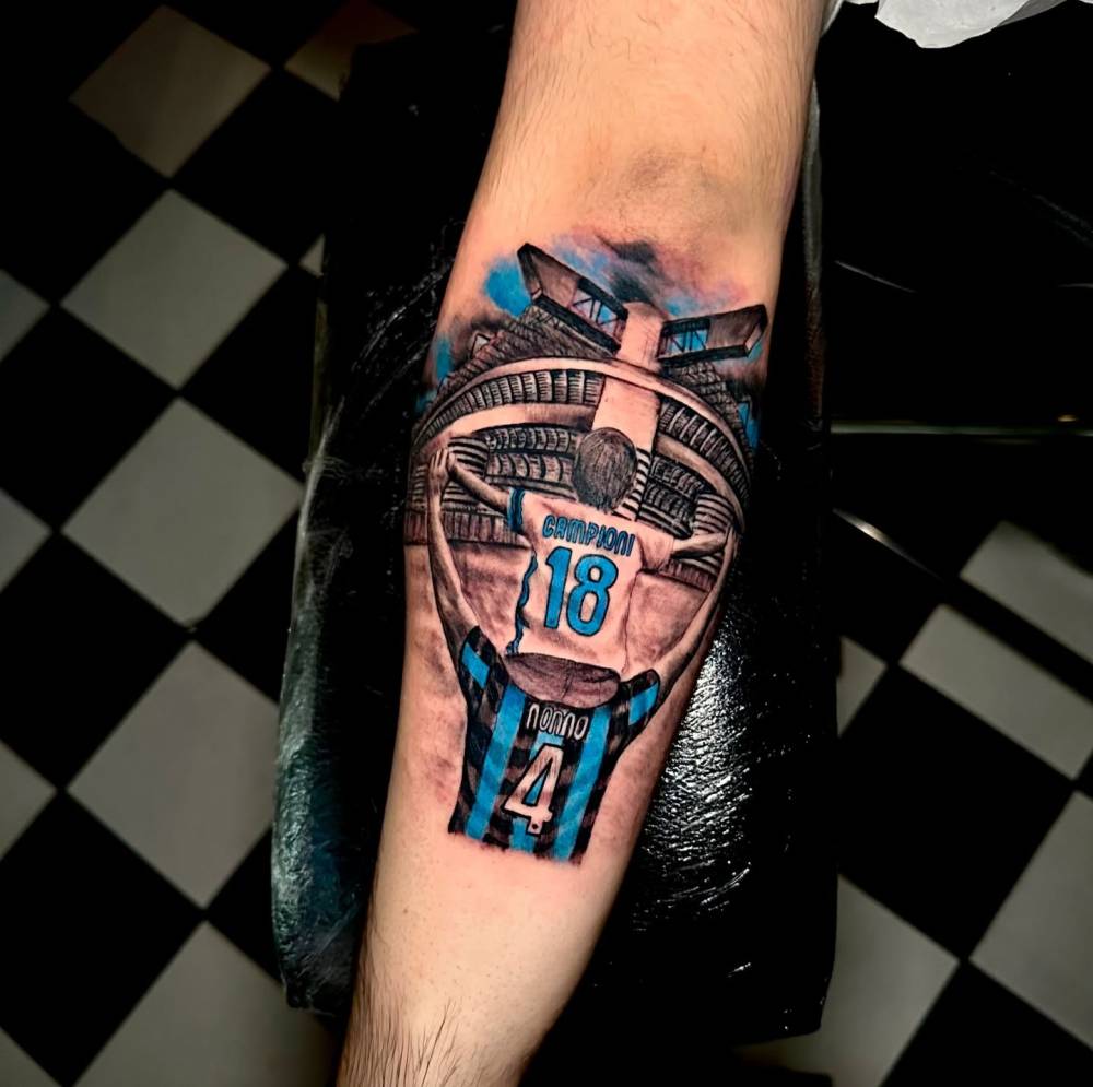 Inter Milan tattoo in illustrative style done on the forearm.