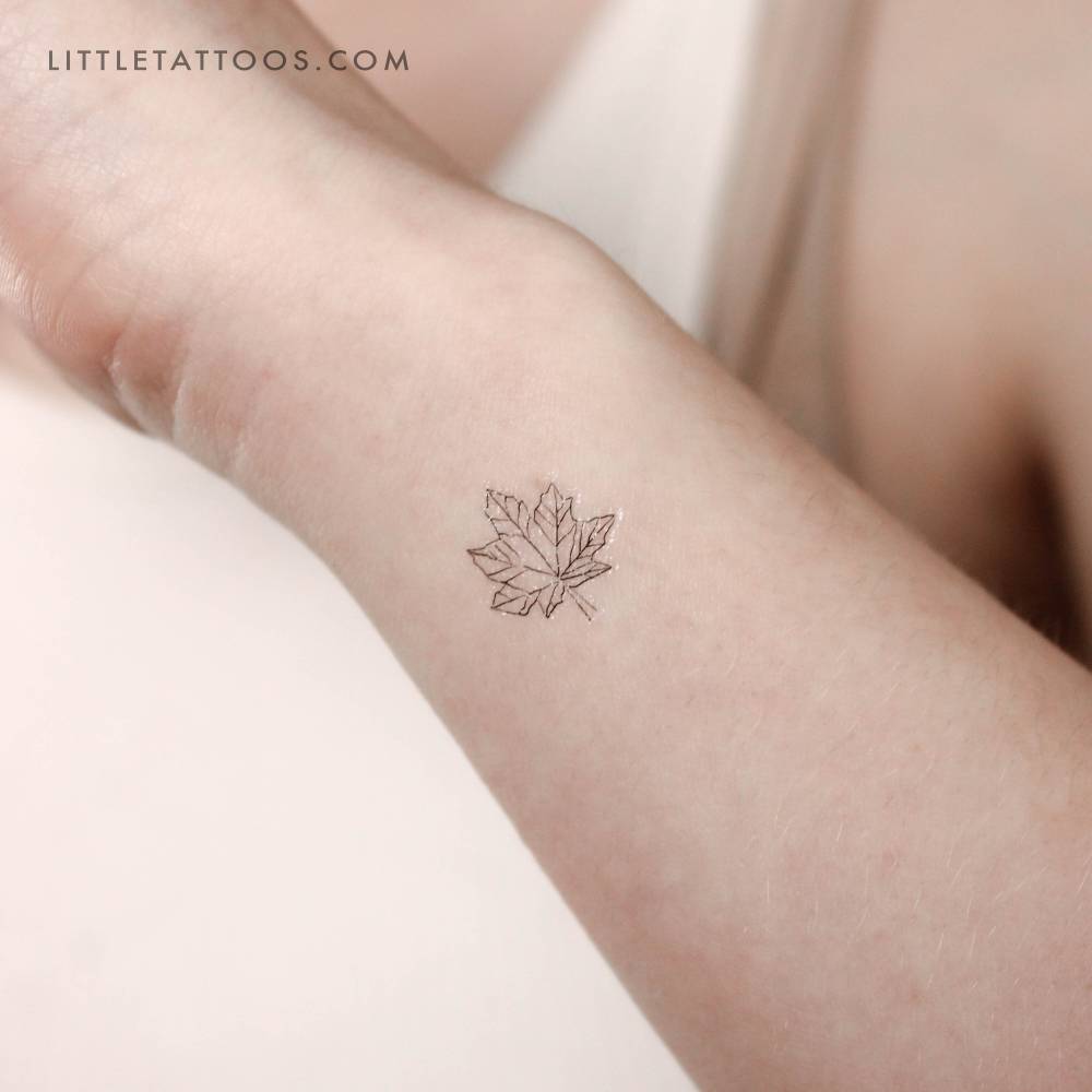 Little maple leaf temporary tattoo located on the wrist.