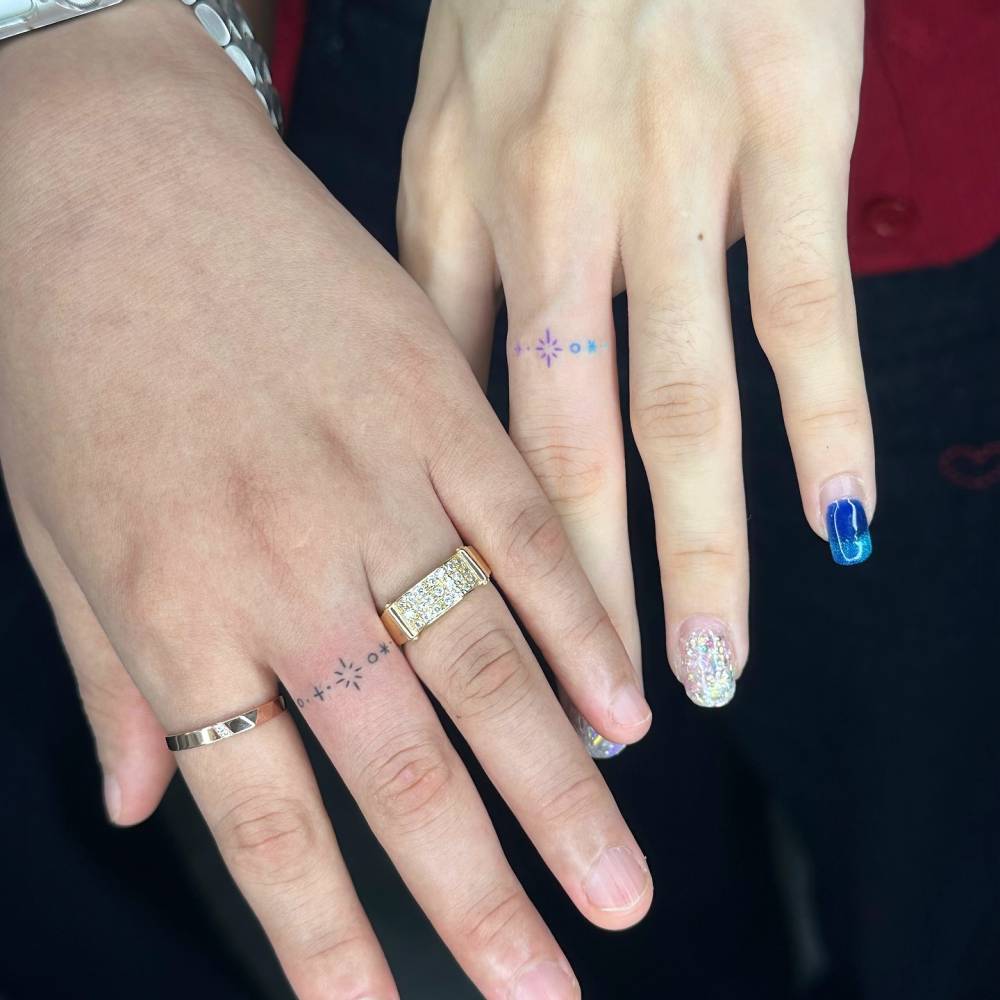 Matching minimalistic ring tattoo for couple.