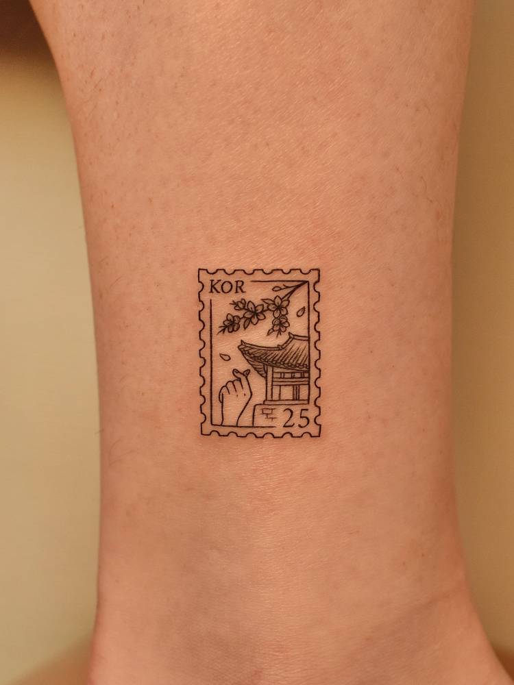 Korean stamp tattoo in fine line style located on the ankle.