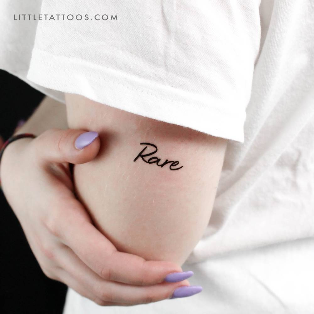 "Rare" temporary lettering tattoo located on the tricep.
