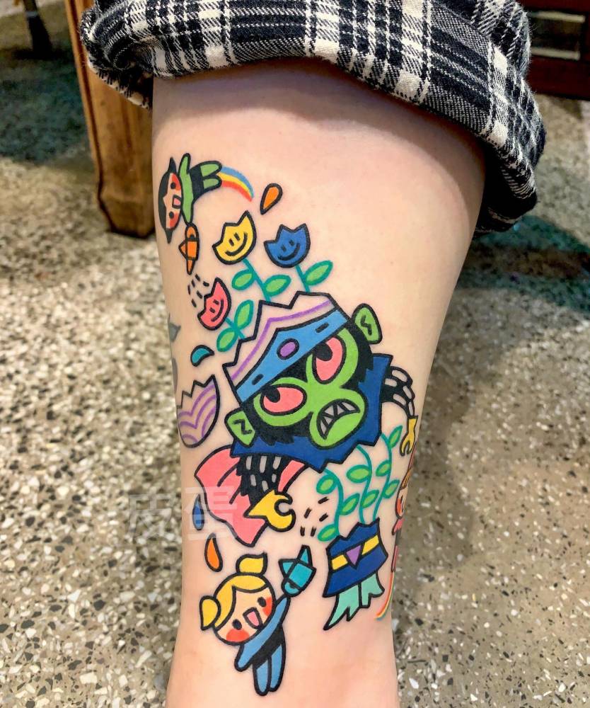 The Powerpuff Girls tattoo in cartoon style located on the ankle.