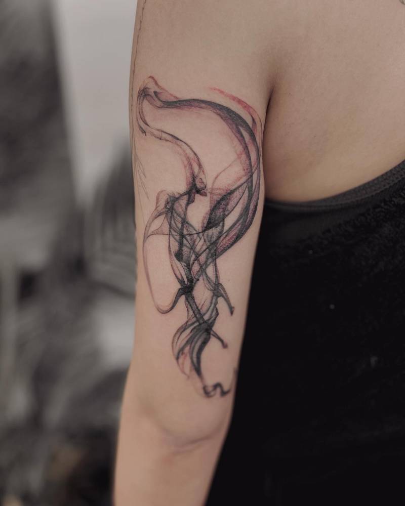 Abstract flow tattooed on the tricep.