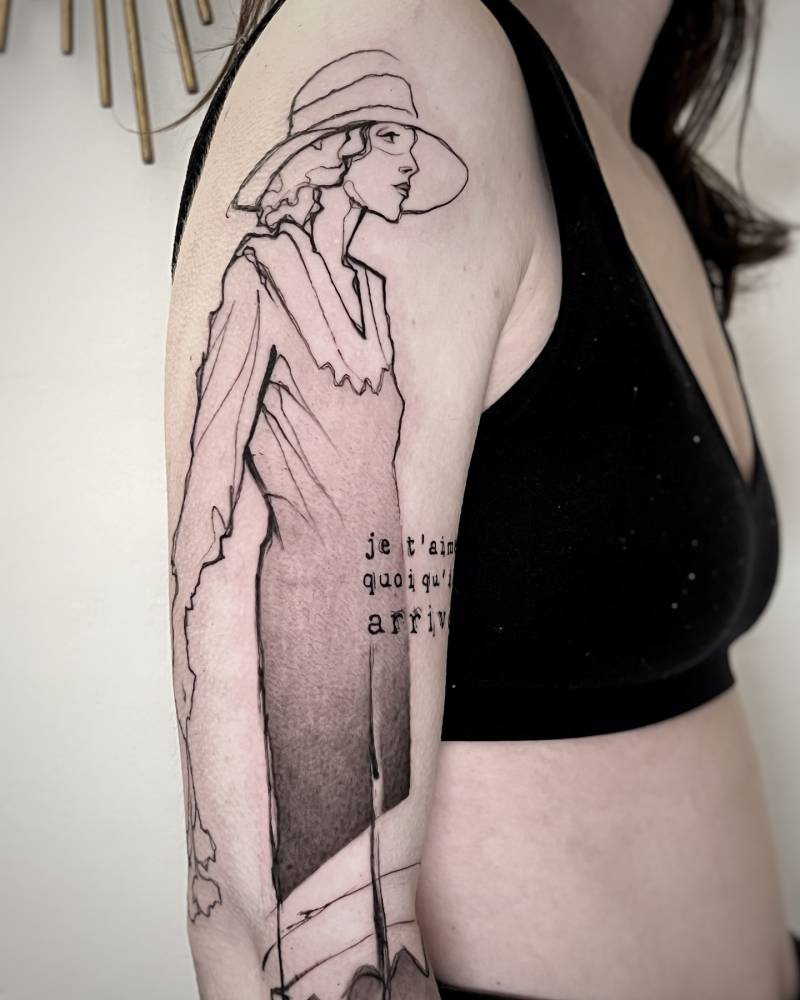 Woman tattoo in sketch work style located on the upper arm.