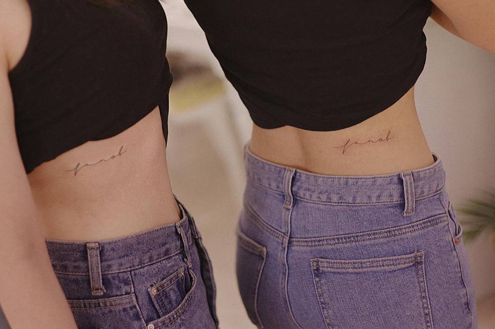 Matching handwritten lettering tattoo for best friends.