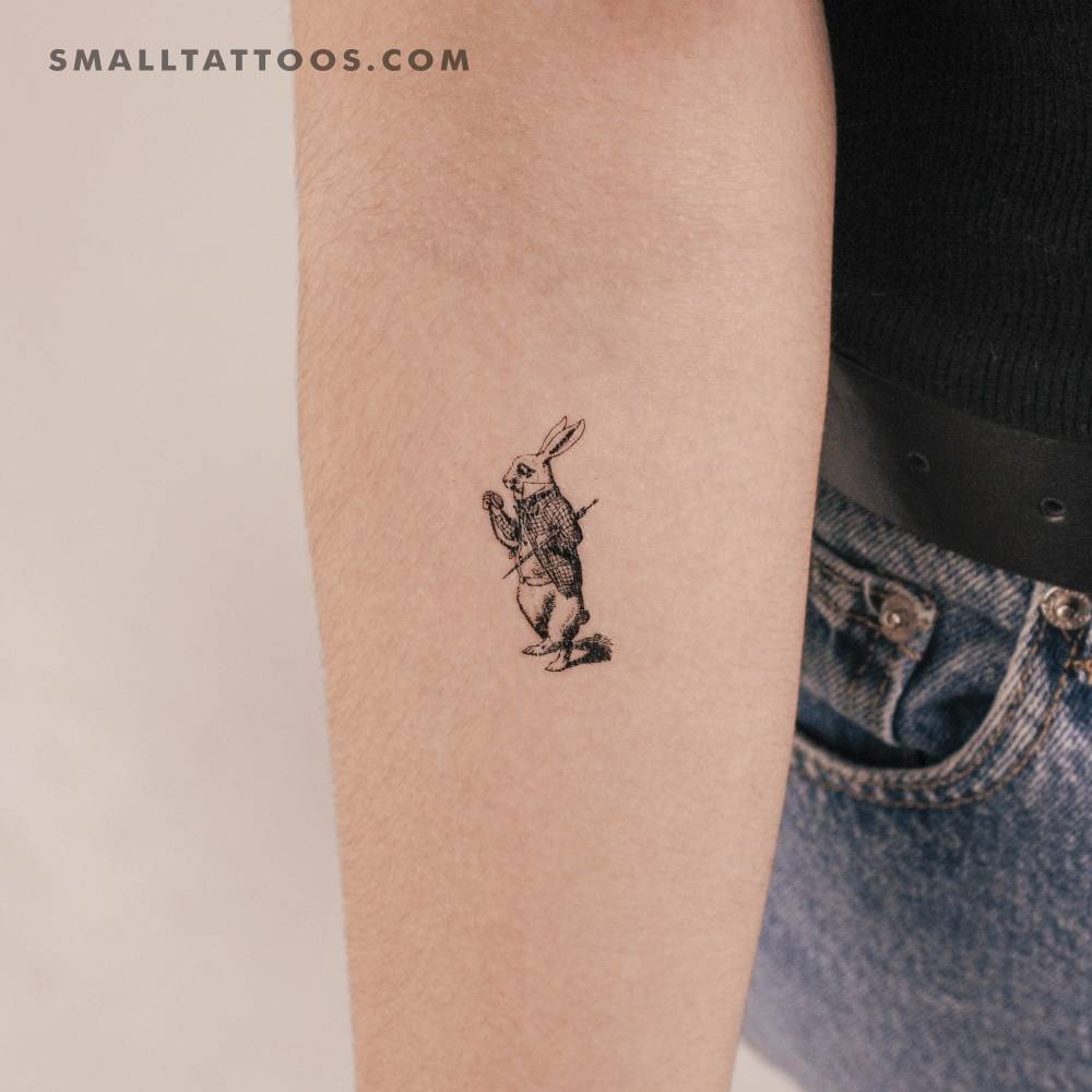 White Rabbit temporary tattoo located on the inner forearm.