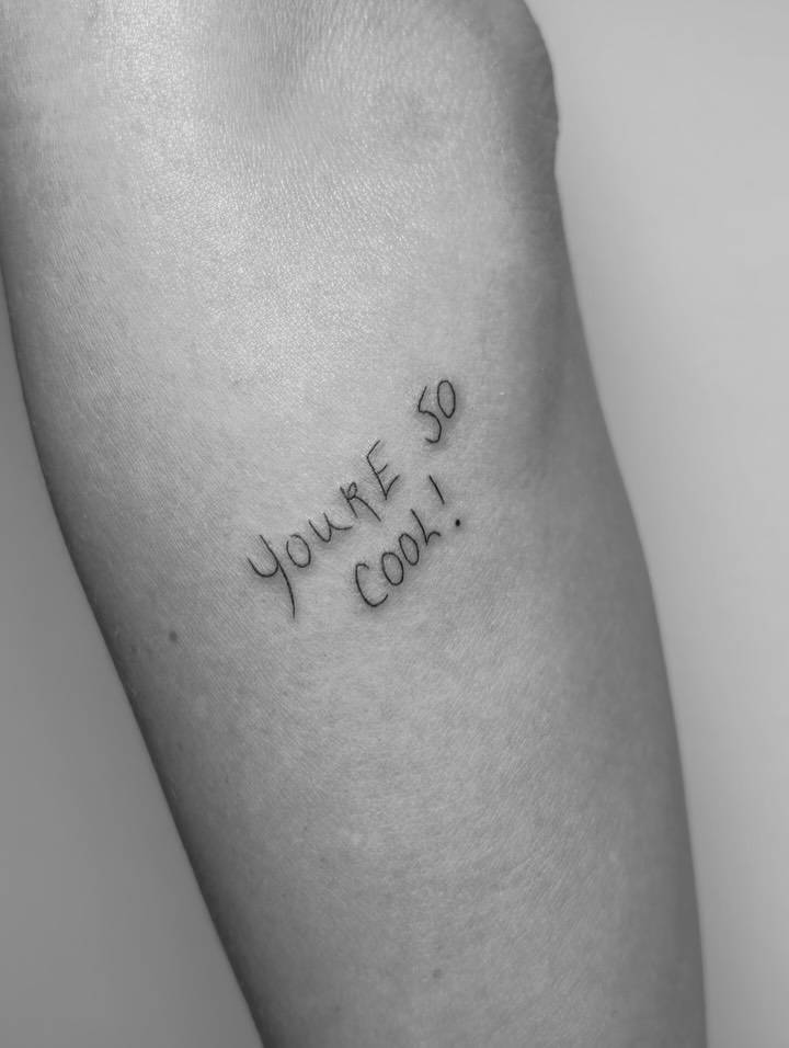 True Romance's "you're so cool" line tattooed on the forearm.
