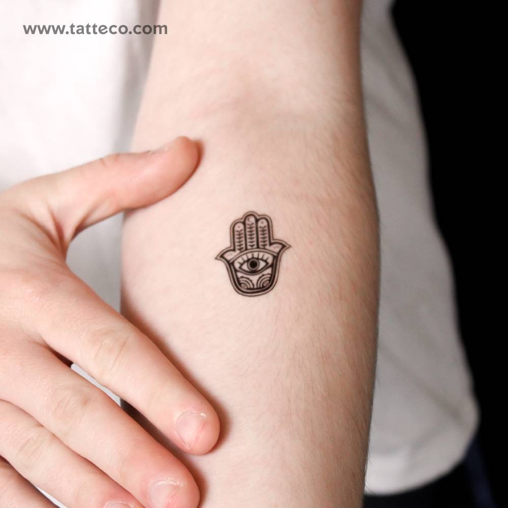Hamsa semi-permanent tattoo located on the inner forearm.