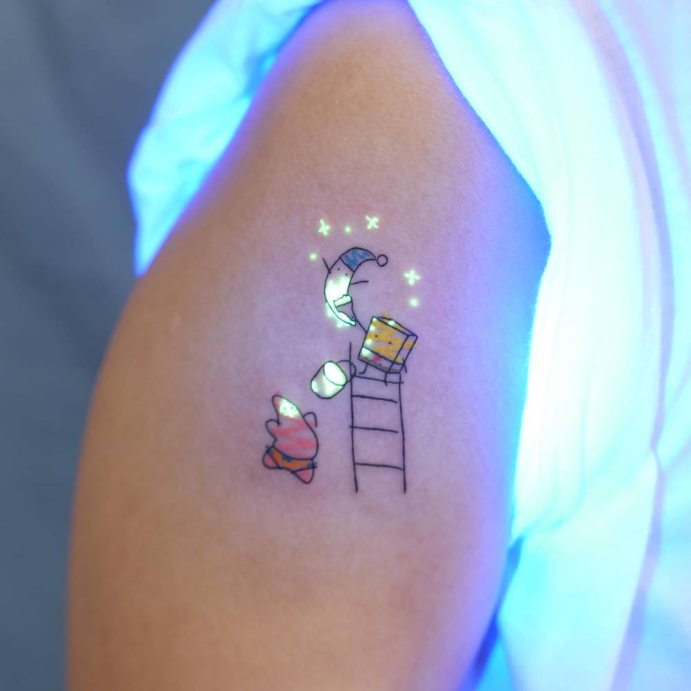Spongebob and Patrick Star tattoo located on the upper arm.