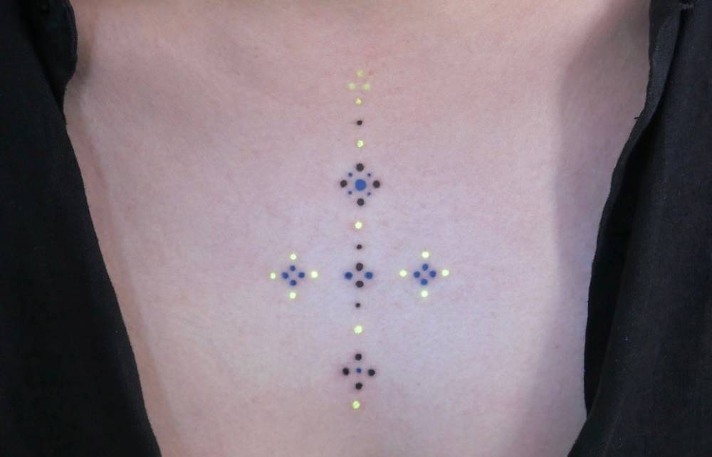 Ornamental design tattooed on the chest.