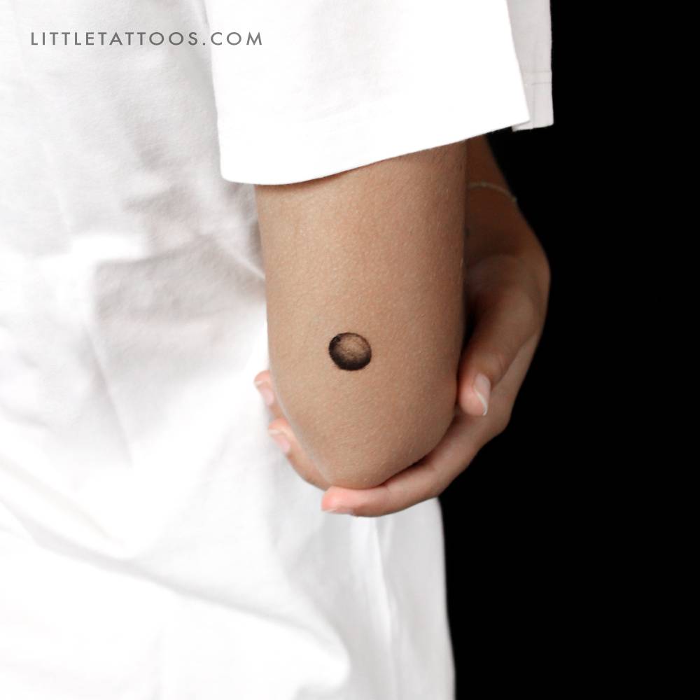 Coconut temporary tattoo located on the tricep.