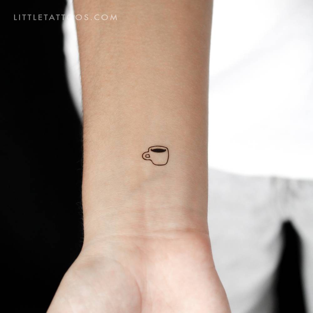 Tiny coffee cup temporary tattoo located on the wrist.