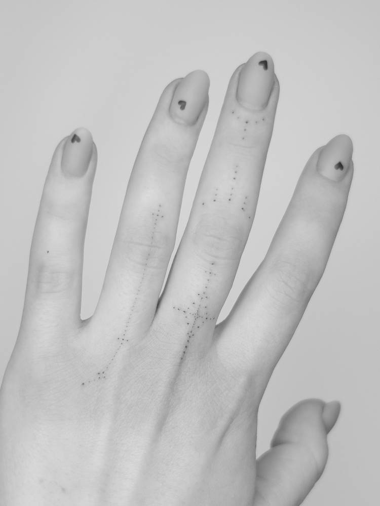Finger ornament composition tattoos.