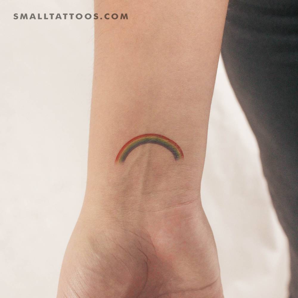 Color rainbow temporary tattoo located on the wrist.