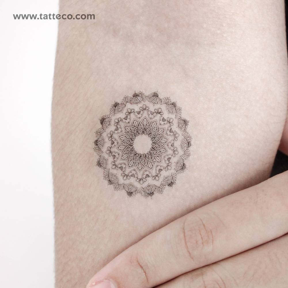 Flowerage mandala temporary tattoo located on the inner forearm.
