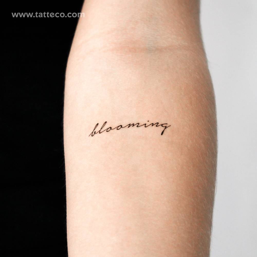 Handwritten font word "blooming" temporary tattoo.