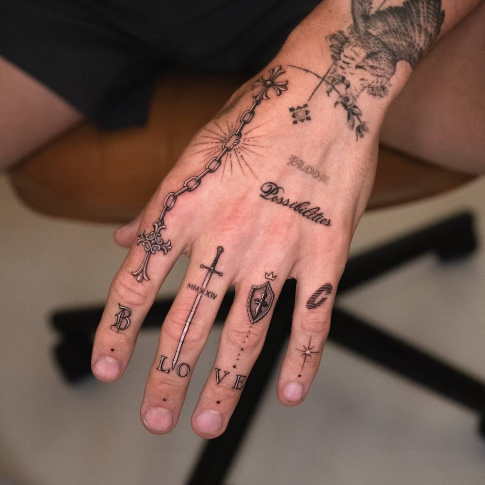 Hand composition tattoos in illustrative style.