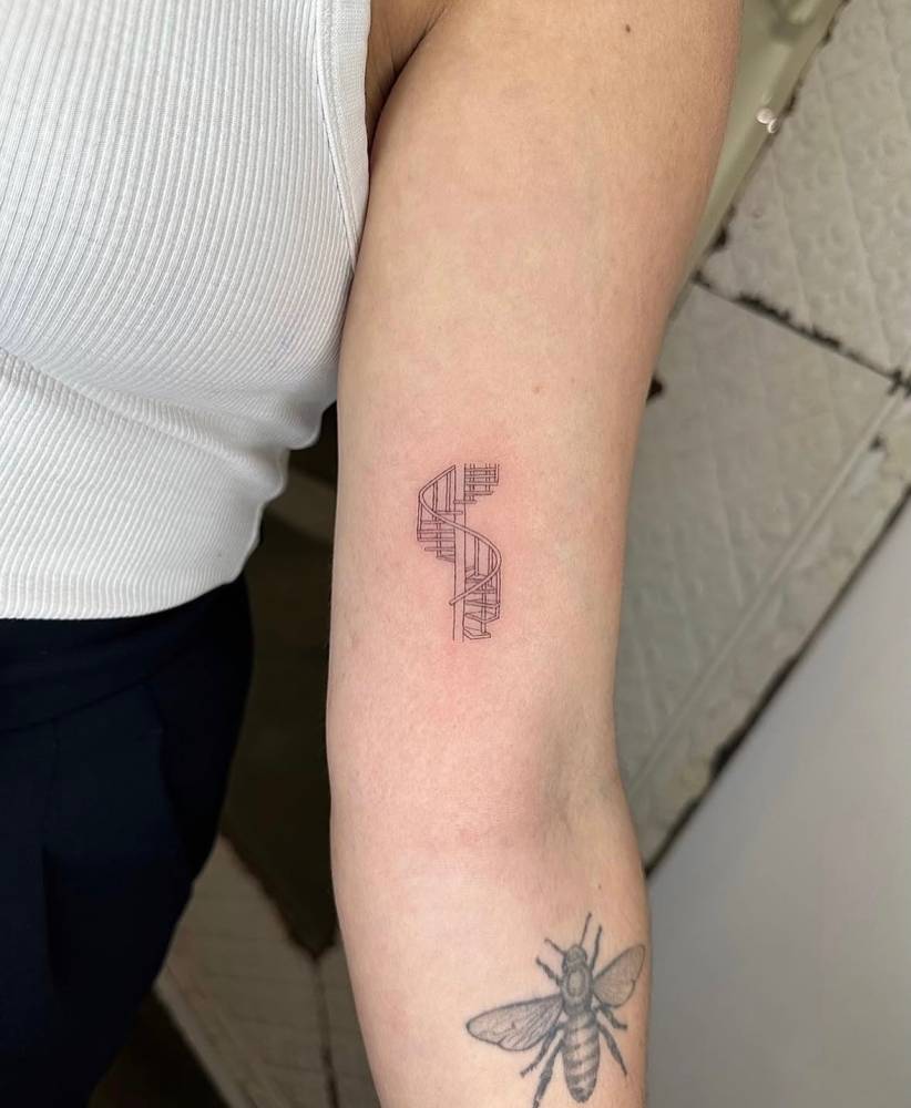 Single needle stairway tattoo located on the inner arm.