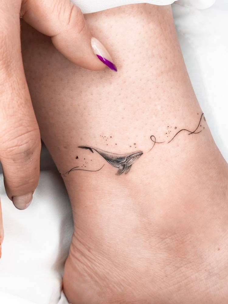 Whale ankle band tattoo in micro-realistic style.