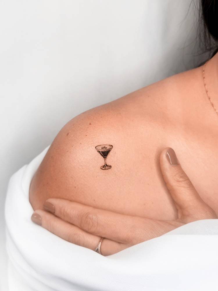 Espresso Martini tattoo located on the shoulder.