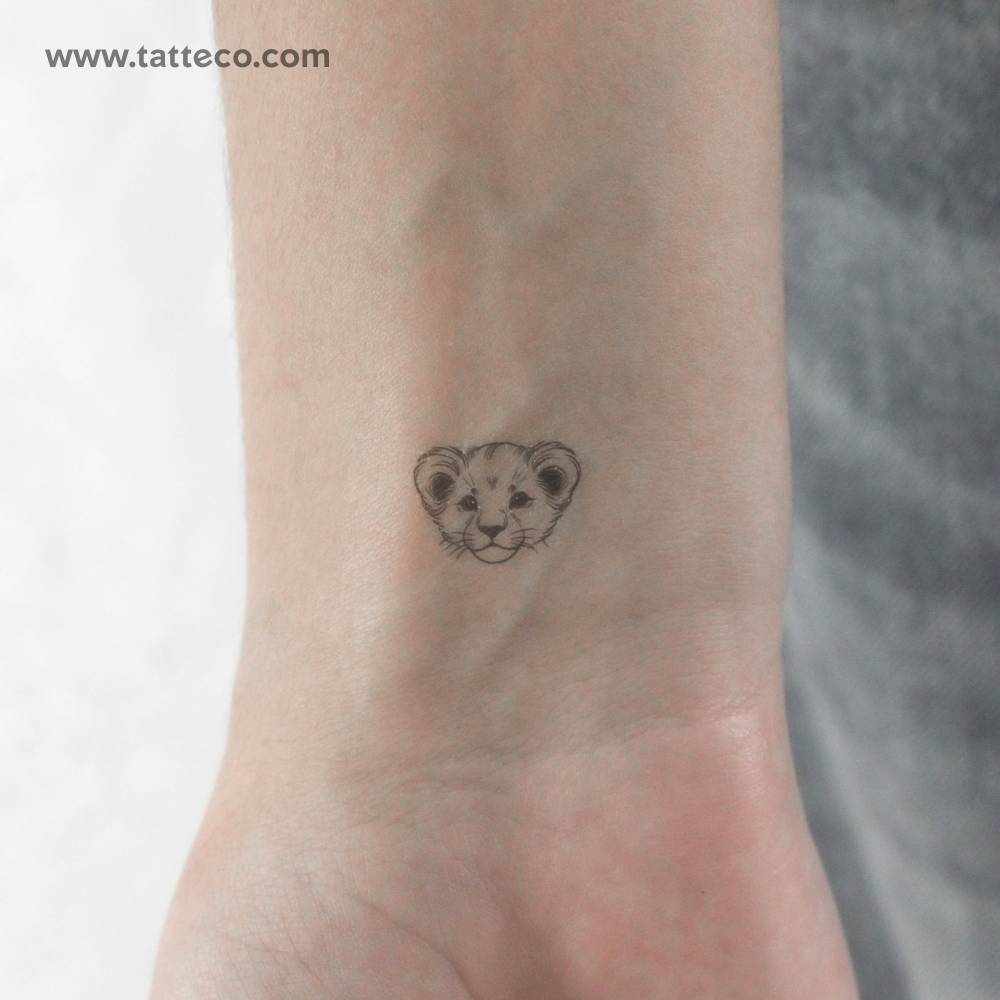Lion cub portrait temporary tattoo located on the wrist.