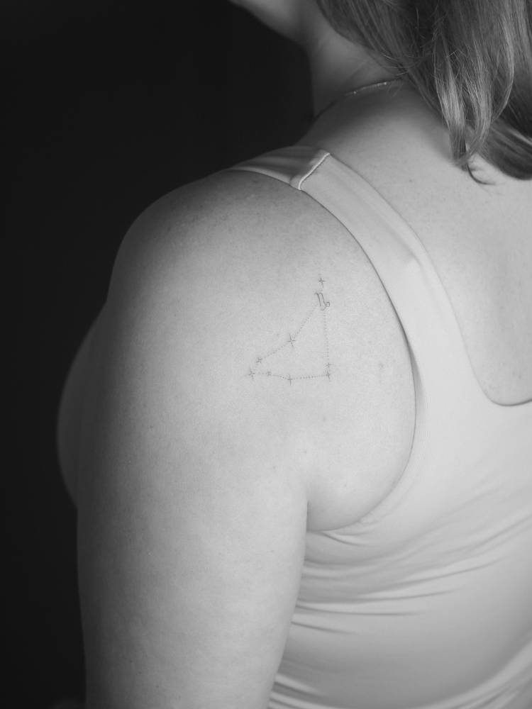 Capricorn constellation tattoo placed on the shoulder blade.