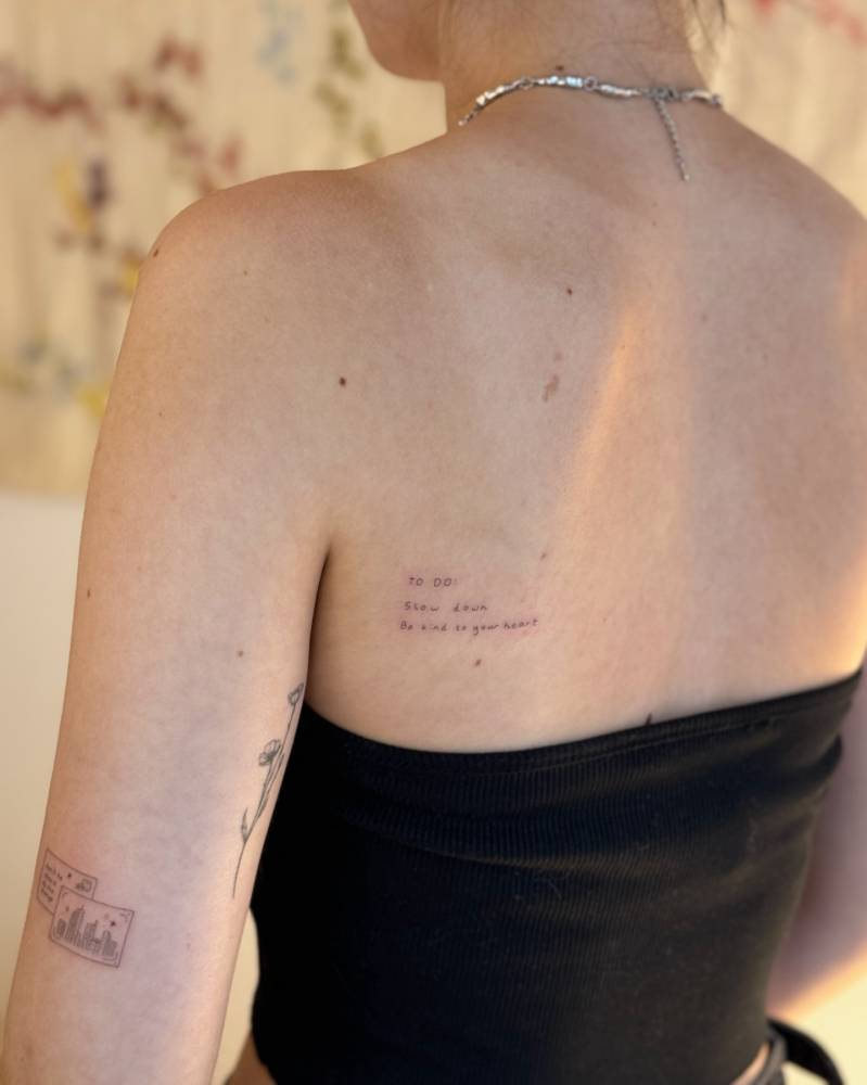 To do list tattoo located on the shoulder blade.