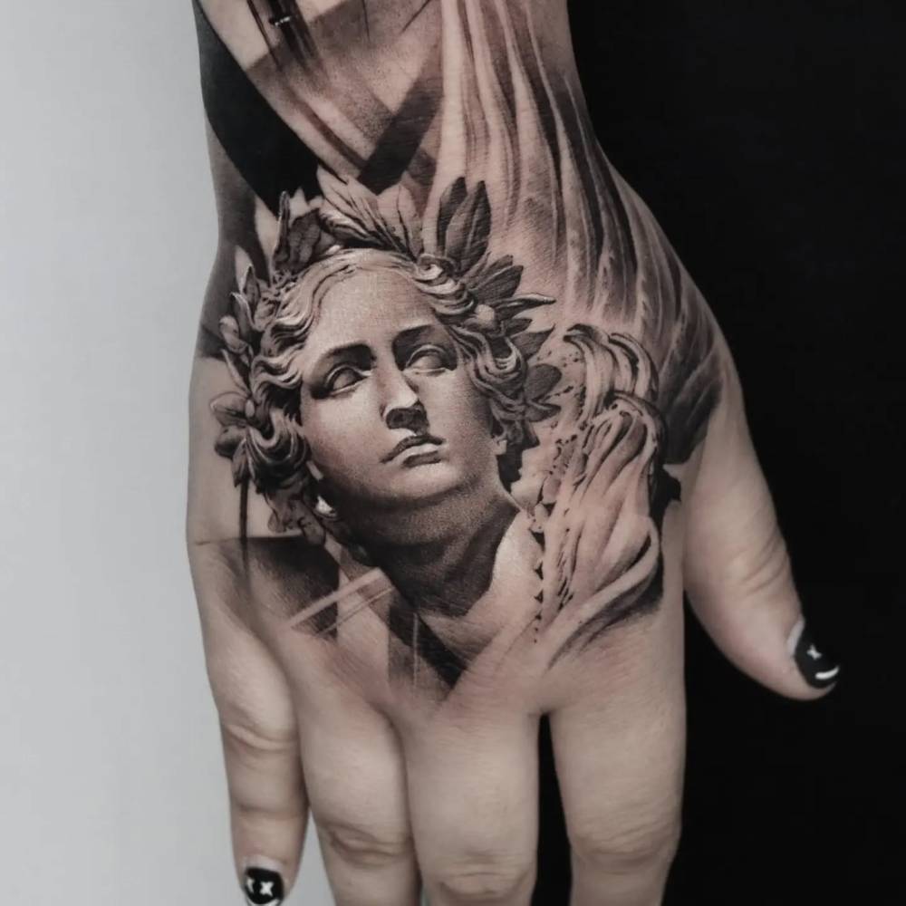 Classical style Athena portrait tattoo located on the hand.