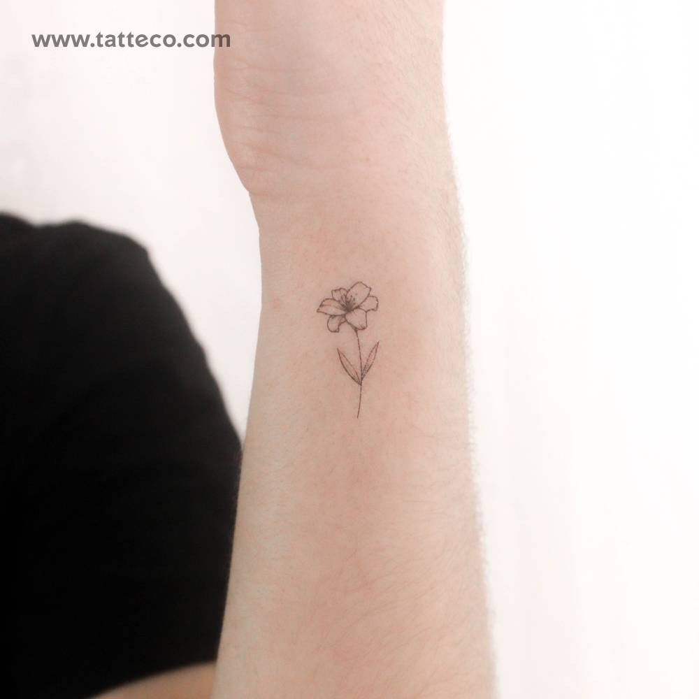 Lily flower temporary tattoo located on the wrist.
