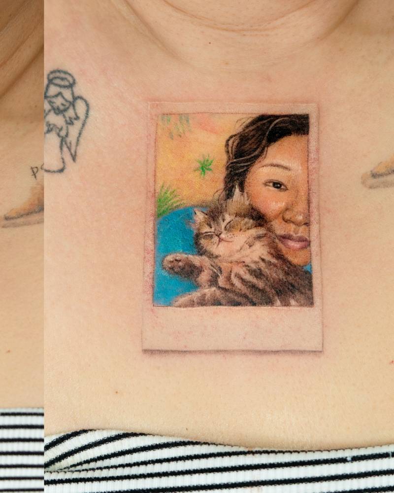 Polaroid picture with her cat.