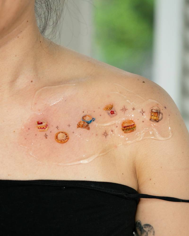 Food galaxy tattoo located on the shoulder and chest.
