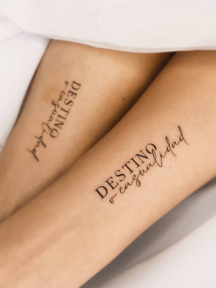 Destino o casualidad matching lettering tattoo for best friends.