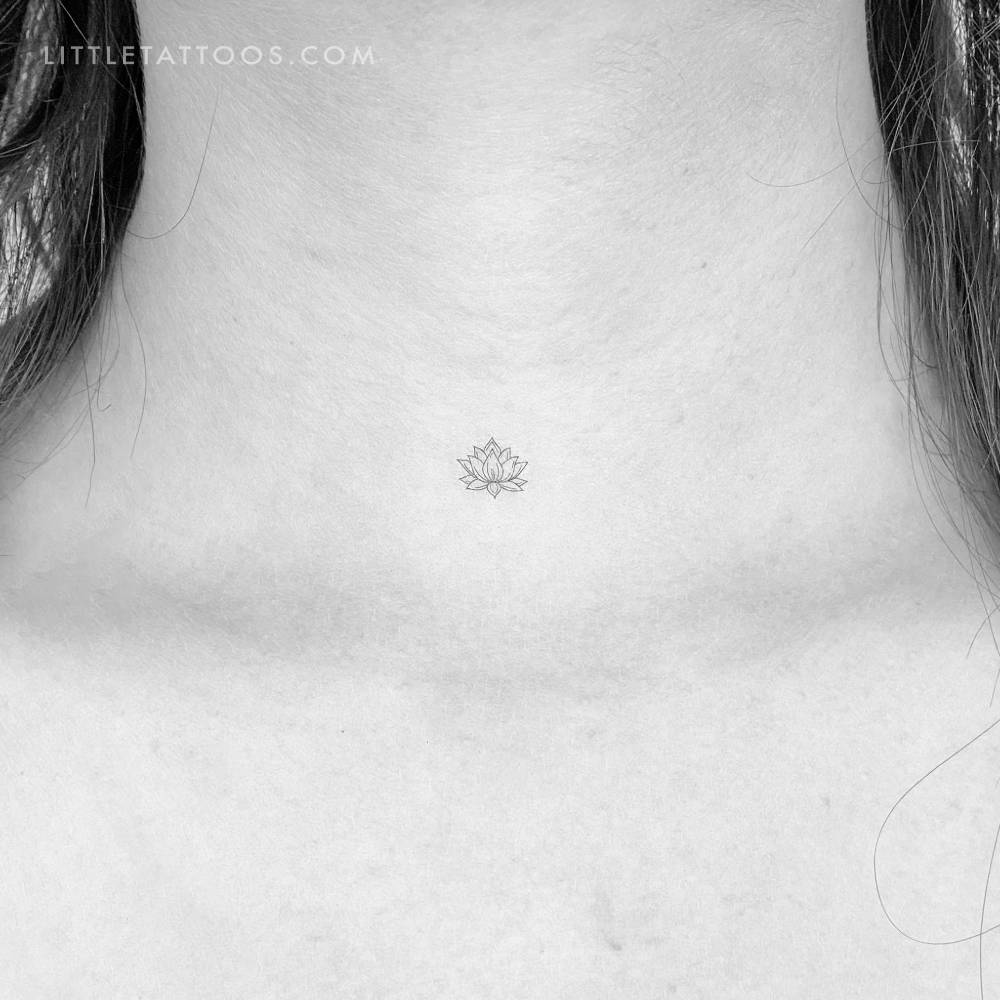 Sacred lotus flower temporary tattoo located on the throat.