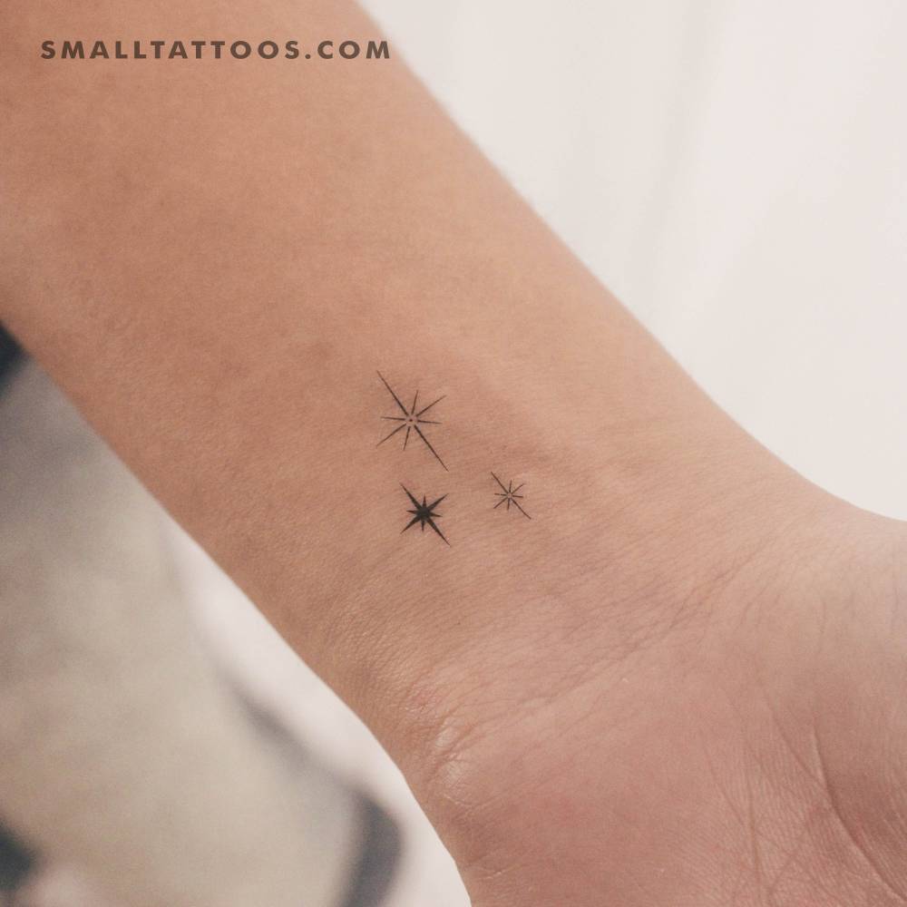 Three sparkles temporary tattoo located on the wrist.