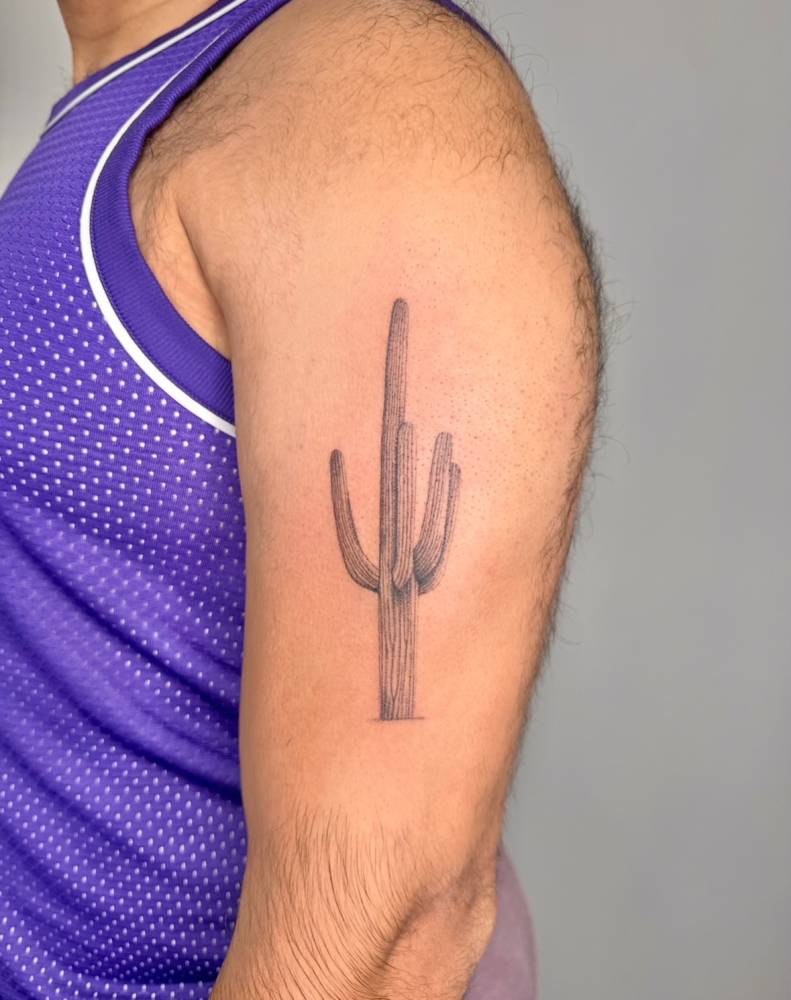 Saguaro tattoo in illustrative style located on the upper arm.