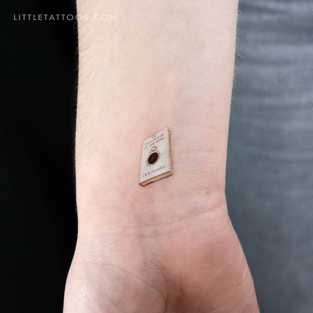 'The Fellowship Of The Ring' book temporary tattoo in micro-realistic style.